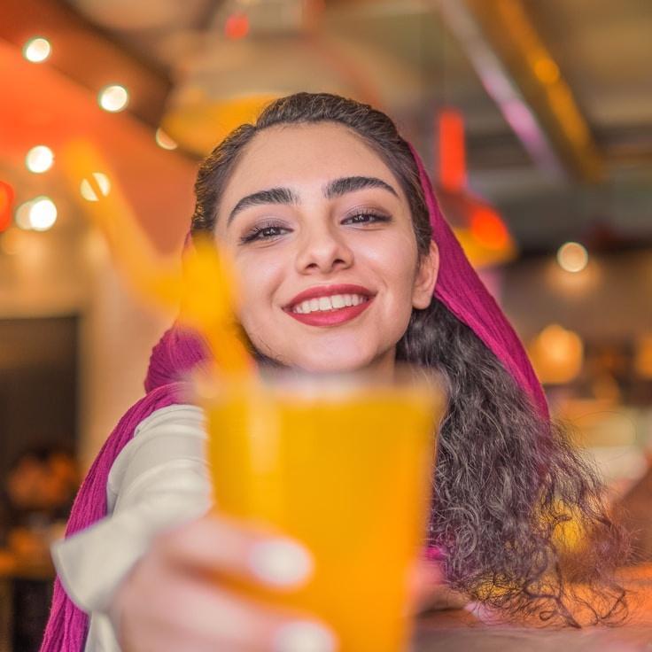 Kaveri Mehta, Lead Design Curator at SerenePathNavigator, reviewing corporate floral arrangements